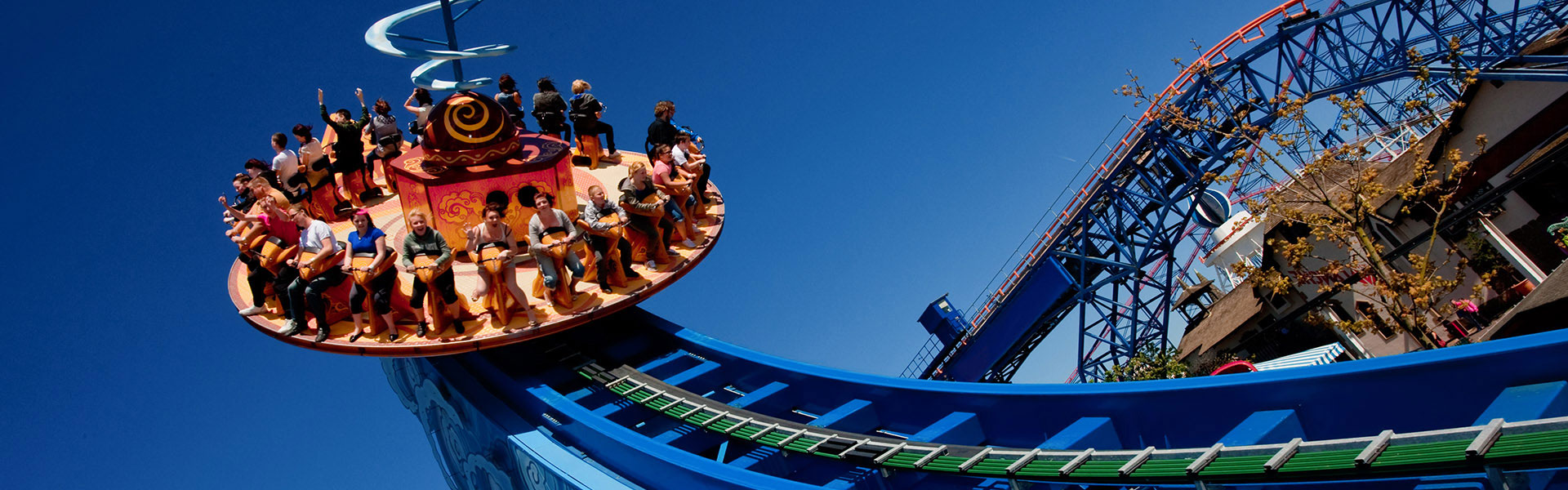 A group of people on an outdoor theme park ride